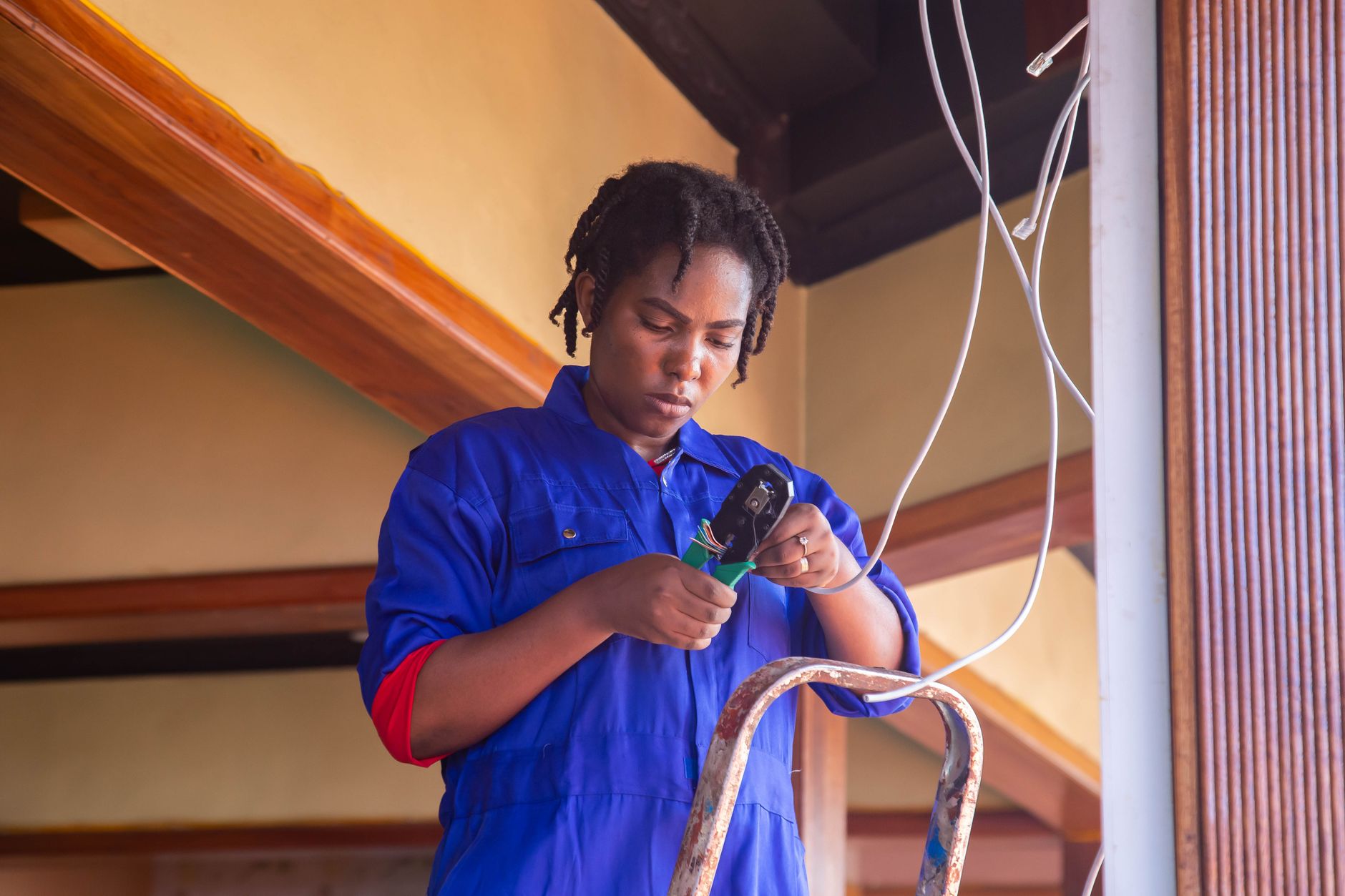 Doncaster electrician from X.Q Electrical Ltd working carefully on domestic wiring installation